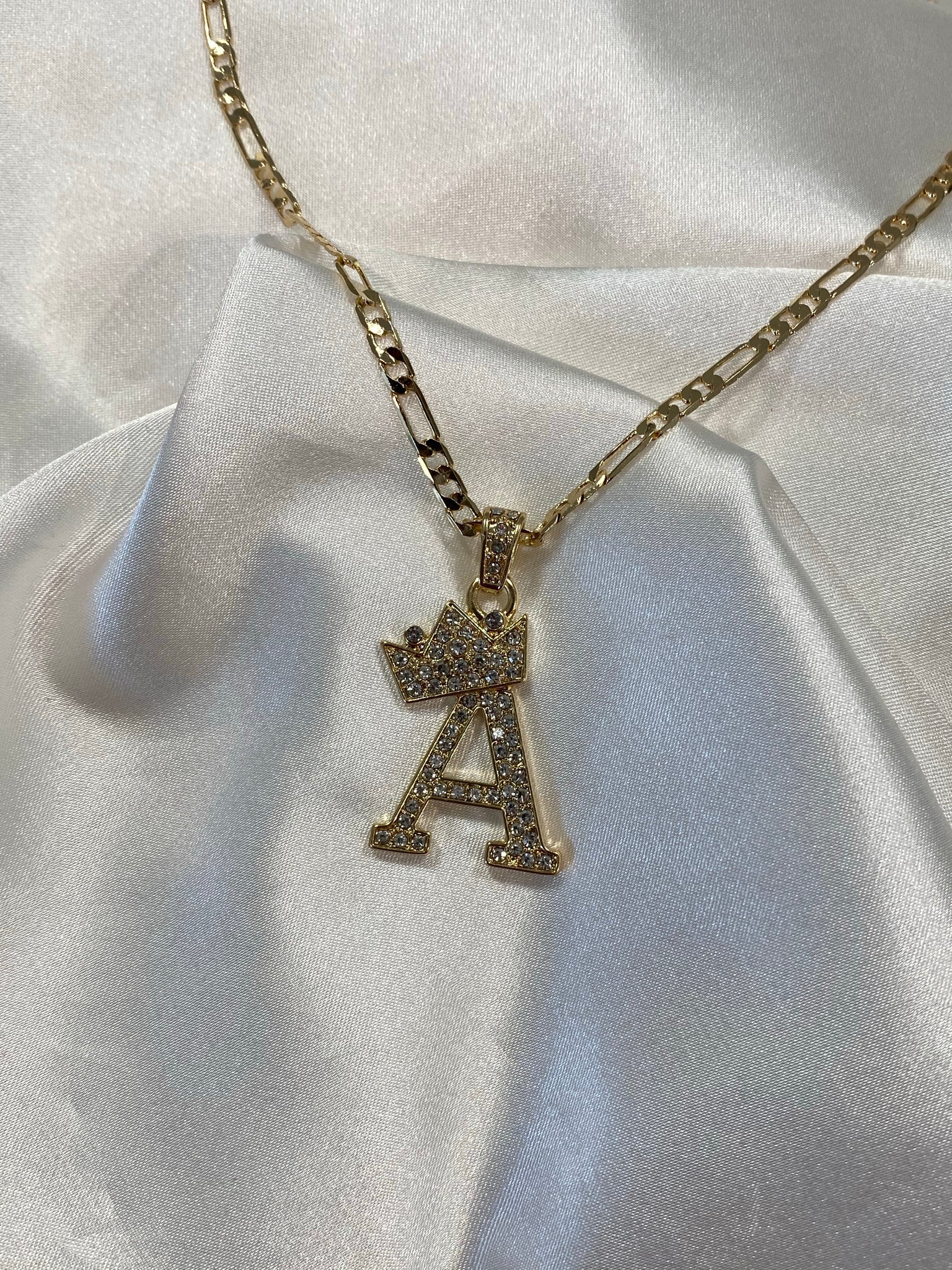 Crown and initial
