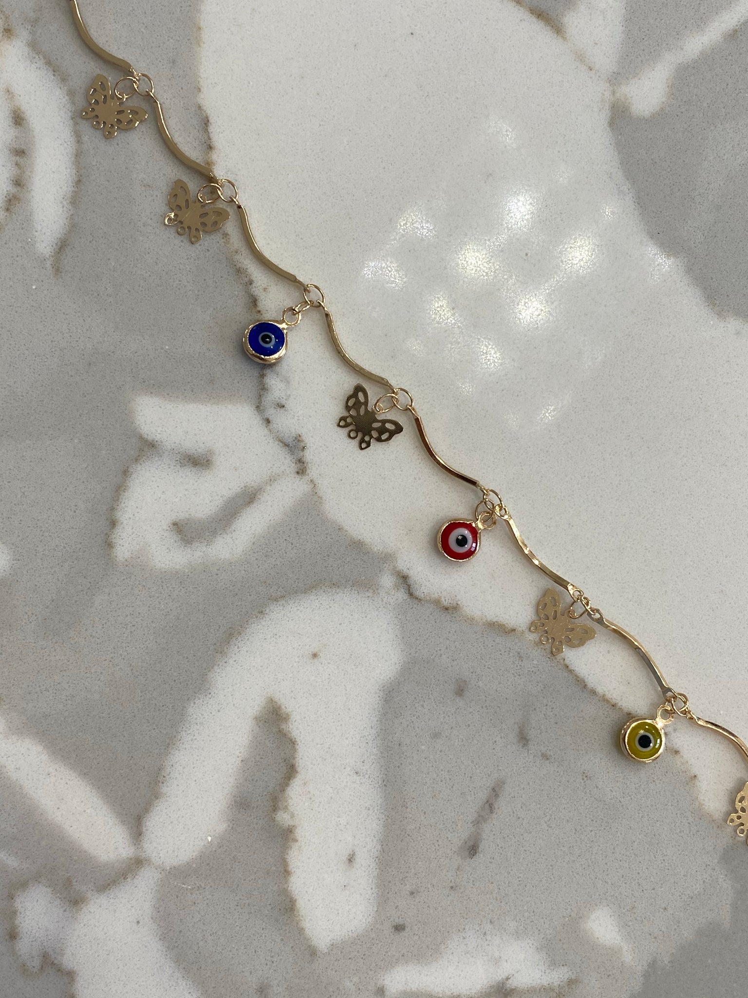 Mini ojo butterfly anklet